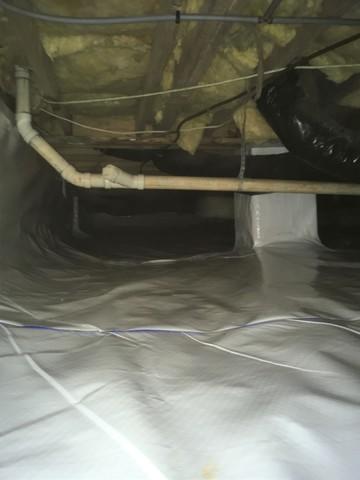 After clearing out the original covering, we installed our CleanSpace vapor barrier which is incredibly durable inside a crawl space.