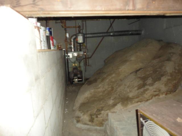 Water was able to seep in through the exposed ledge in this Putnam Valley, NY basement. To prevent this in the future, we installed our CleanSpace crawl space encapsulation system over the area. This durable plastic liner prevents water and odors from entering the basement, and it comes with a 25 year warranty against rips and tears. Water will no longer leak in through the ledge!