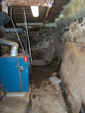 The fieldstone walls of this Cross River, NY basement were allowing water to leak into the room through small cracks in the mortar joints. To prevent this in the future, we installed our CleanSpace Wall System around the perimeter of the room. This durable plastic wall system directs any water that gets through the walls into the perimeter drainage system. The sump pump then pushes it out of the basement, keeping the area dry. 