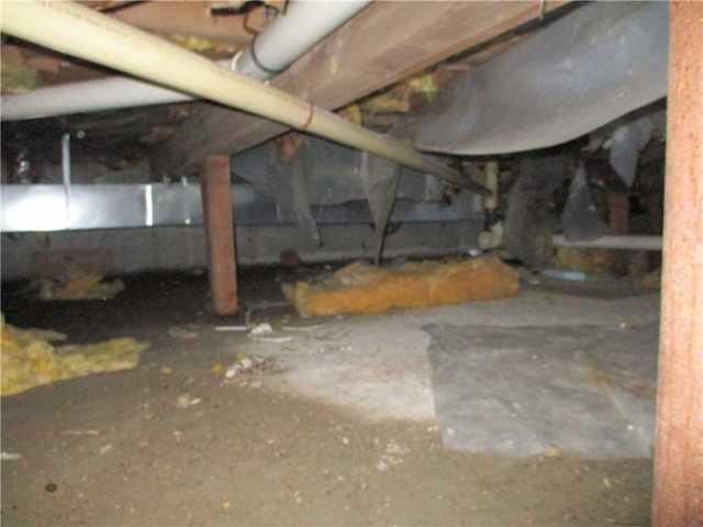BEFORE: Insulation and Plastic on Floor