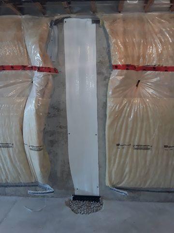 When the in-floor drain and sealant in place, Mark poured fresh concrete to bring the floor back to grade and give the repair a finished look