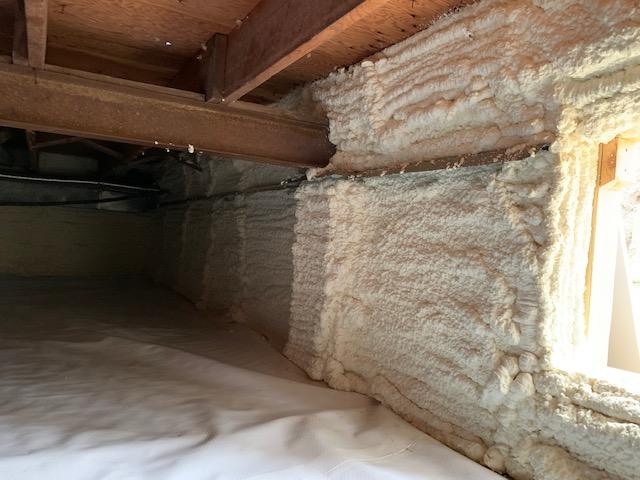 Spray foam installed snug and clean over rim joists and window.