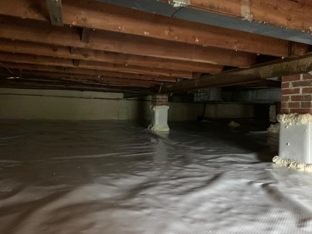 Clean, bright crawl space - old insulation fully removed.