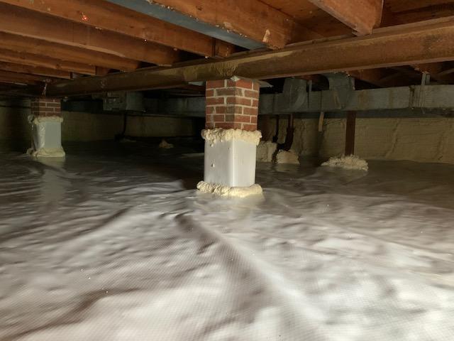 Clean, bright crawl space - old insulation fully removed.