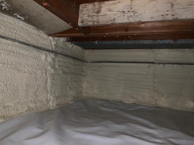 Beautiful installation of floor-to-ceiling spray foam overtop of CleanSpace liner.