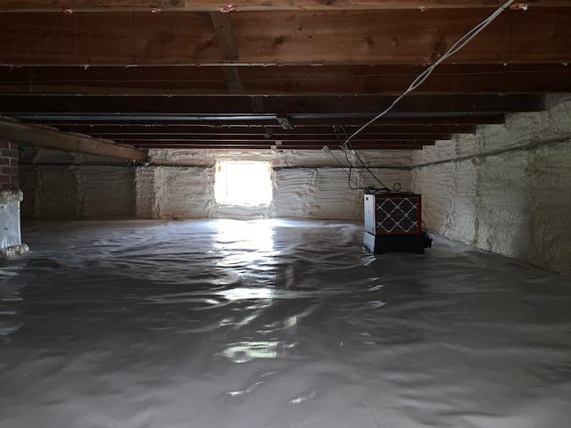 Bright new crawl space - no more mold or rotting insulation. SaniDry Sedona dehumidifier installed.