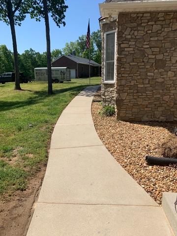 The sidewalk is no longer a tripping hazard.