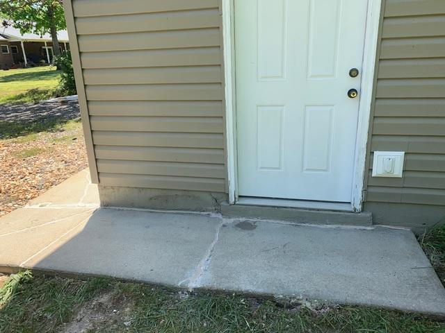 This sidewalk is now level and is no longer separating from the house.