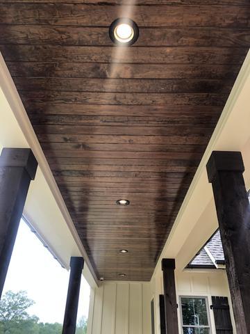 <p>Smooth cut tongue and groove porch ceiling with can lights.</p>