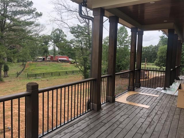 <p>Here we installed Cedar post and a cedar handrail using the Fortress Fe26 Traditional Railing system. Smooth cut cedar porch ceiling.</p>