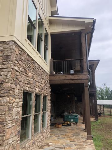 <p>We installed the post, Fe26 Fortress Railing System, the cedar beam. The smooth tounge and grove porch ceiling on the upper porch ceiling and a rough cut cedar porch ceiling on the lower portion.</p>