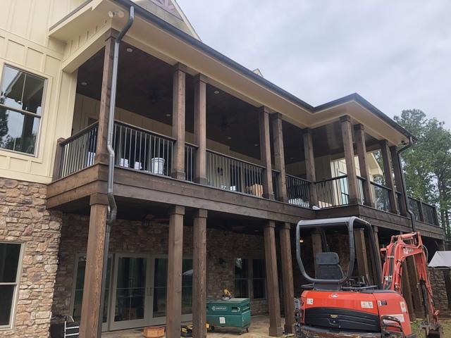 <p>We installed the post, Fe26 Fortress Railing System, the cedar beam. The smooth tounge and grove porch ceiling on the upper porch ceiling and a rough cut cedar porch ceiling on the lower portion.</p>