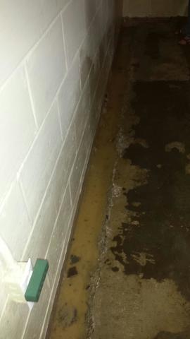 <p>The trenches were cleaned out and weep holes were drilled in the block to release water pressure inside the block. Look at how much water entered the basement! It's a good thing this homeowner contact us to waterproof their basement.</p>