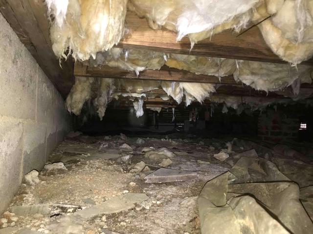 The exposed dirt in this crawl space was a source for moisture to find its way inside. The ground water would rise and get into the air and walls.