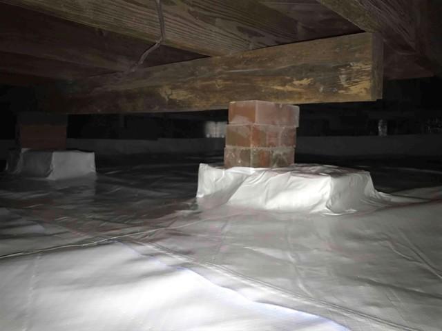 Wrapping up and around block piers is a must inside a crawl space. Water can wick into and be absorbed by blocks from the ground. So, having the vapor barrier around it keeps the water out of the air.