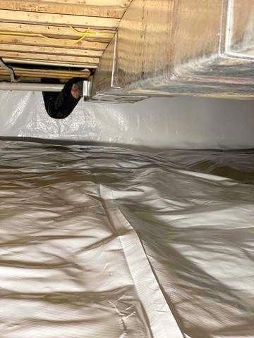 Crawl Space encapsulation with CleanSpace Vapor Barrier that seals the crawl space from the Earth and prevents moisture from passing through