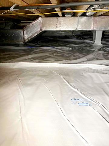 Crawl Space encapsulation with CleanSpace Vapor Barrier that seals the crawl space from the Earth and prevents moisture from passing through