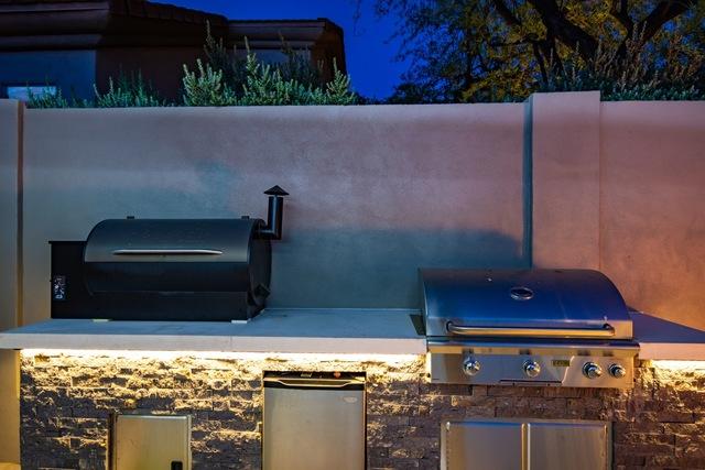 <p>The sidewall is a perfect spot to have the grills. As you can see, the whole yard is set up for entertaining and being able to enjoy the beautiful outdoors that we have here in Scottsdale, Arizona!</p>