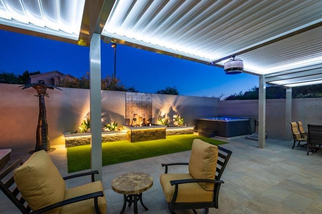 Notice the inset lighting in the louvered ceiling. It creates a nice, peaceful setting for evening and nighttime patio use.