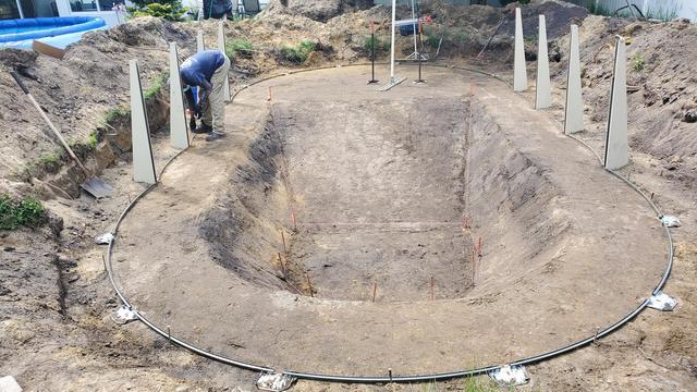 Once the ground is leveled the track is laid down and the pool walls are ready to go up