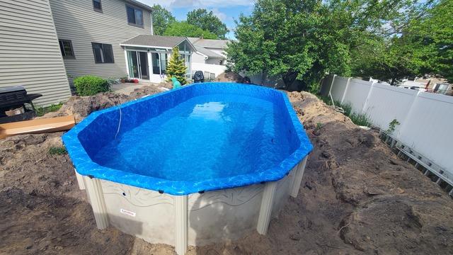 The liner is installed and we are allowing it to properly stretch by slowly filling the pool with water.