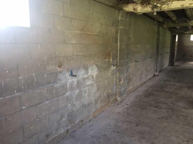 Before Photo - Cracked and Bowing Walls