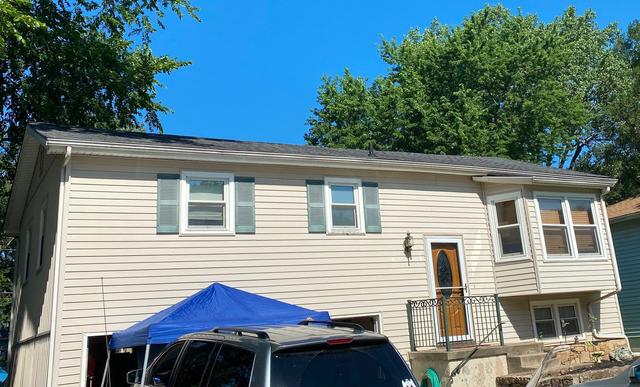 The front of house with new roof replacement.