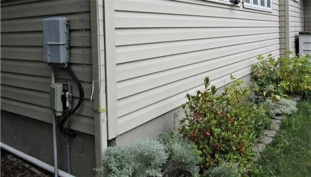 The crawl space was surrounding by the poured foundation walls, as seen in this exterior photo.