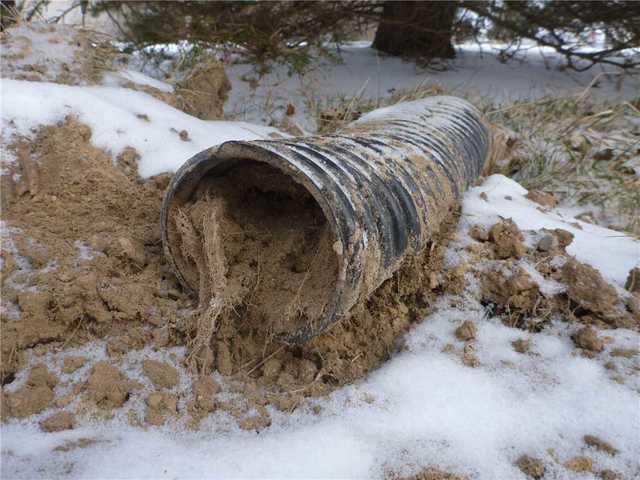 This discharge line is clearly unable to transport any water discharged from the home.