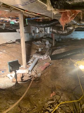 This dirty crawlspace was in bad shape.