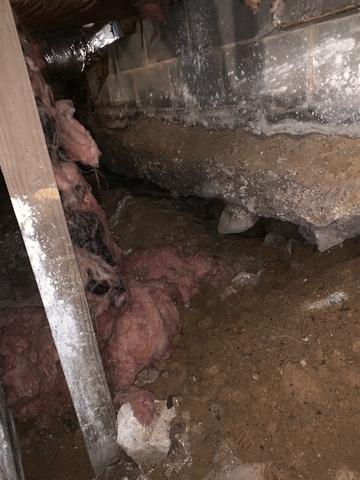 This dirty crawlspace was in bad shape.