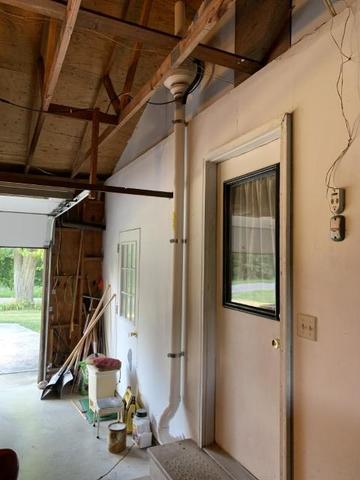 <p>Fan located in garage and vented through the roof.</p>