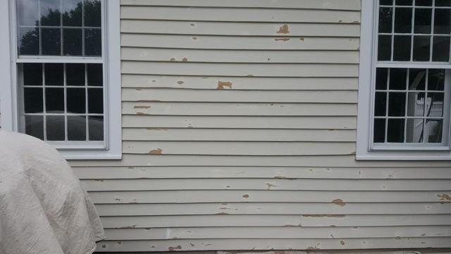 This siding needs new paint.