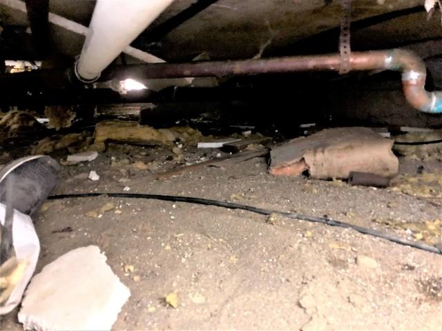 A nasty dirty crawl space before being encapsulated.