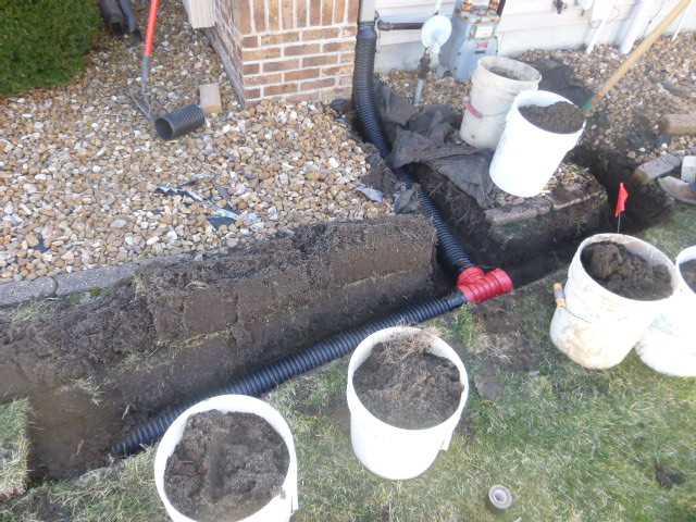 Mid Installation of an Underground Downspout