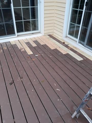 These deck floor boards were replaced before the new stain.