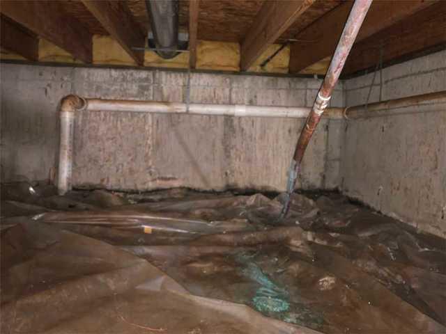 This crawlspace was dirty and smelly before we came in to fix it