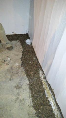 After the installation of the drainage system, it was covered with stone and engineered fill.