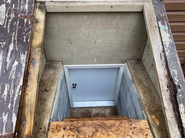 Locking, sealed, insulated crawlspace door.