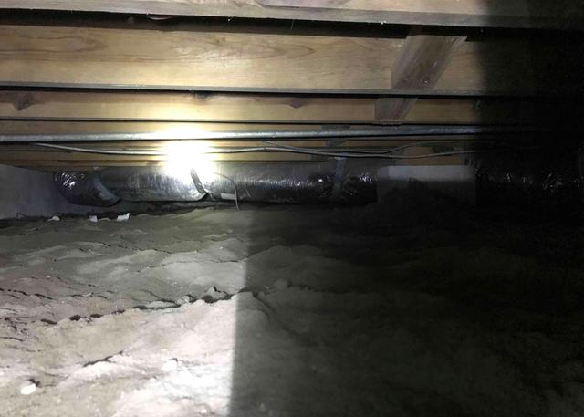 Before the encapsulation system was installed at this home it just happy a dirt floor that allowed moisture to enter the crawl space causing wood rot and musty orders.