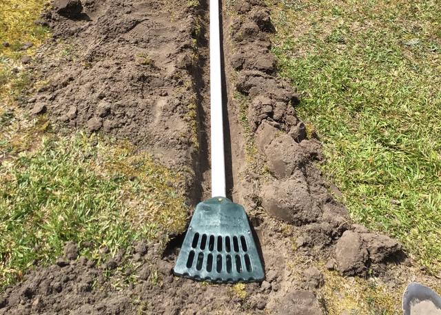 The Lawnscape outlet running from the Smart Sump to outside of the home to ensure the water can't enter back into the crawl space.