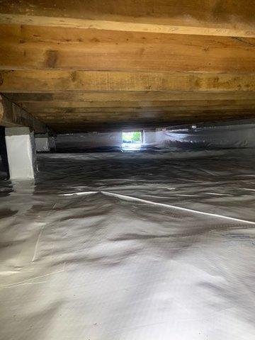 The cleanspace liner is carefully cut and installed. The workers will usually be working in their socks to keep the liner clean. That's how clean your crawl space will be.