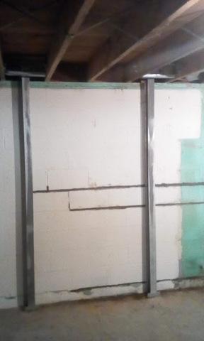 These support beams are meant to stabilize the wall and help restore structural integrity