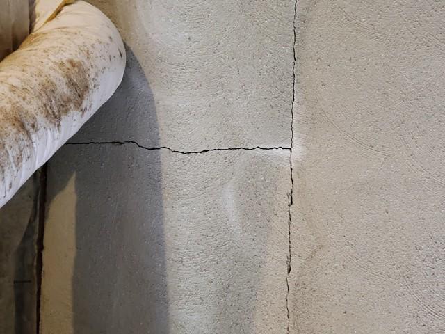 This foundation crack is an indicator of settling and shifting soil around the house. It is likely that the ground will continue to move. As foundation damage goes unaddressed, it will become more difficult to repair.