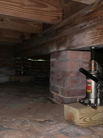 Failing Brick Pier and Bottle Jack