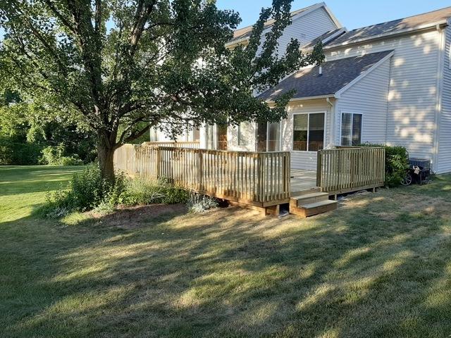 Here is the other side of the treated wood deck with another set of stairs