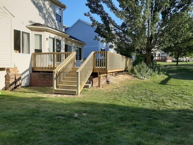 Here is the side view of the deck with the stairs leading to the lawn