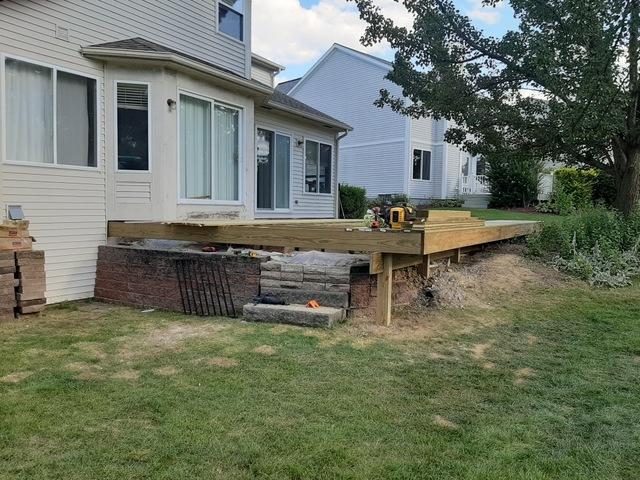 The treated wood deck in progress