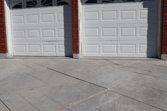 Cars driving over the seam where the driveway meets the garage it was causing the slabs to sink