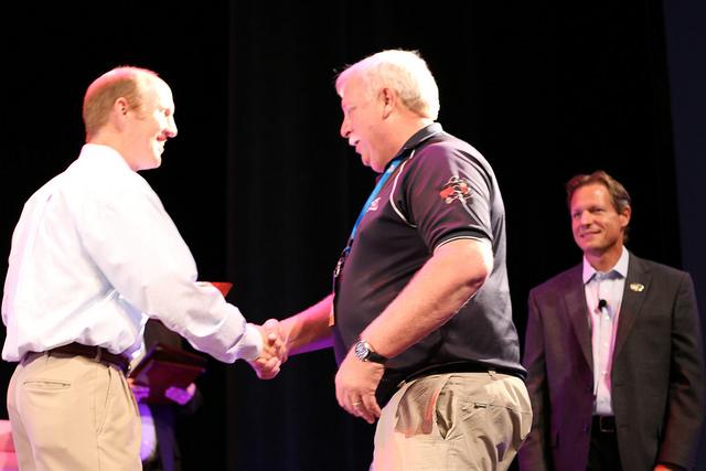 Howard Shaking Hands